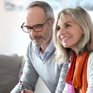 older couple happily working on their finances together