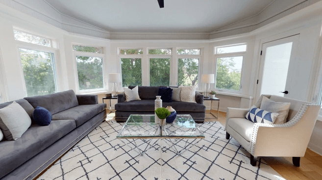 living room with wall of windows