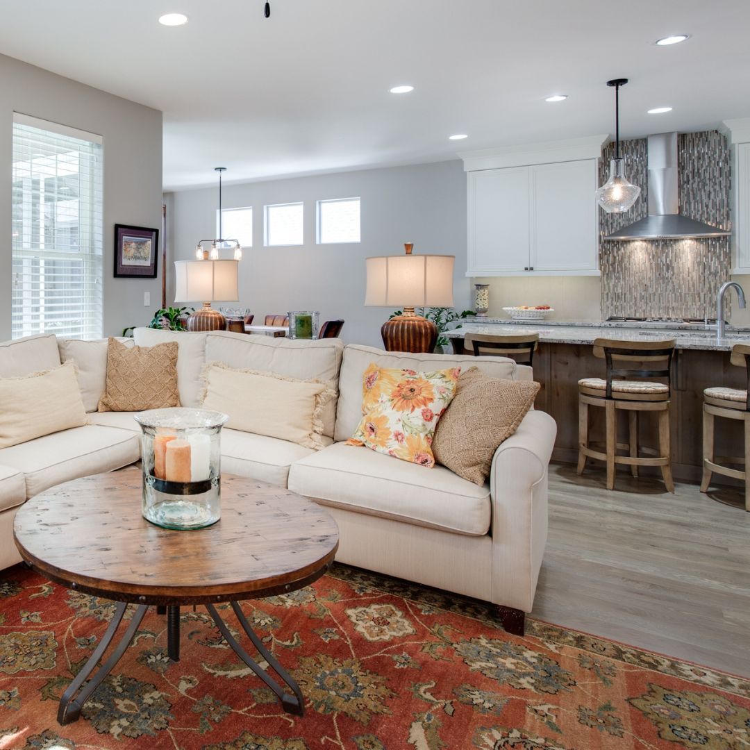 living room with a kitchen in background