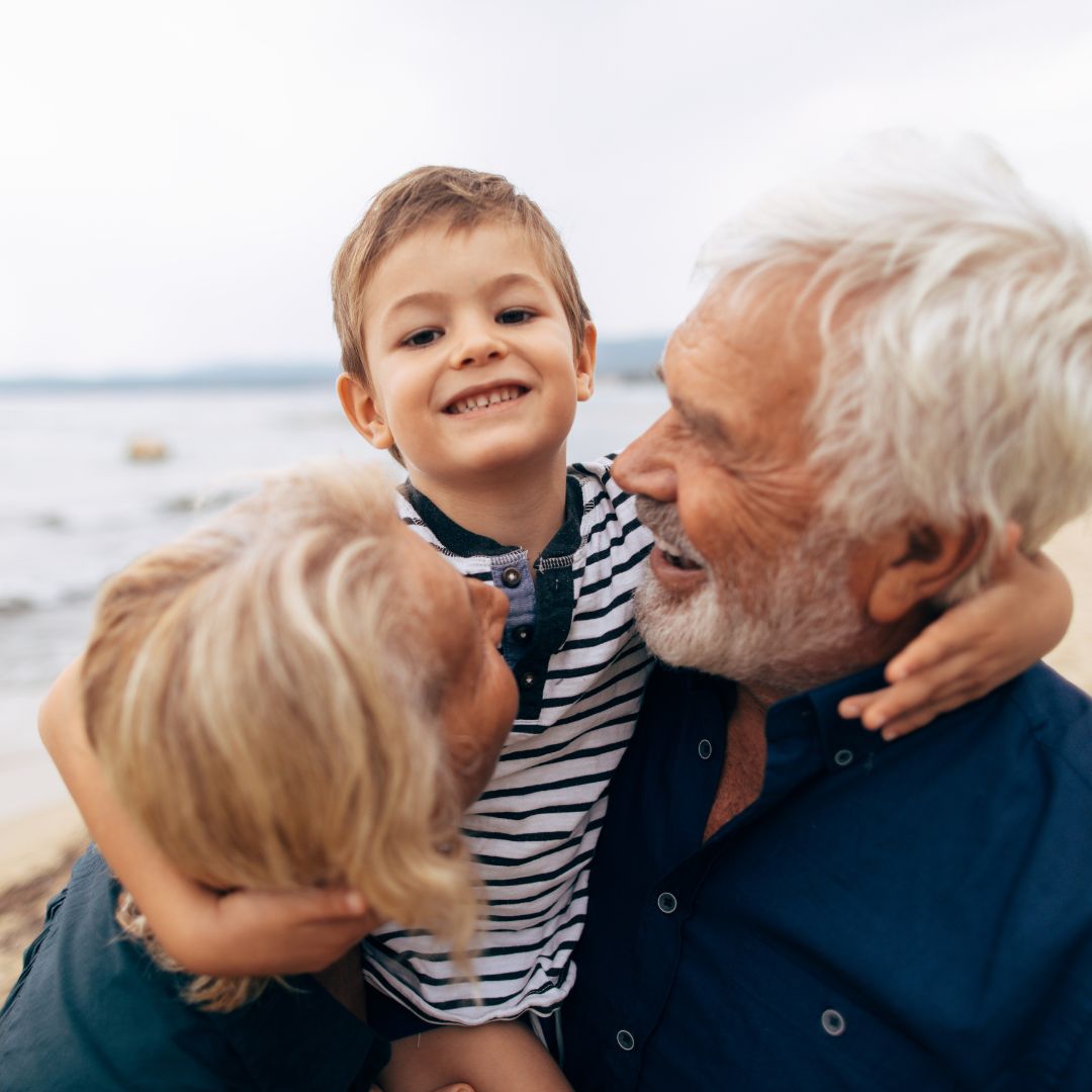 older couple with grandchild between then