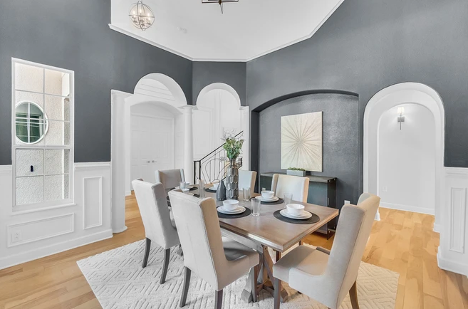 dining room with pillars and high ceilings