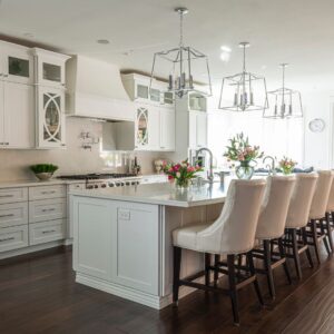 high end kitchen with large pendants over island
