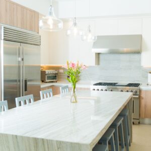 luxury kitchen with quartzite countertops and waterfall edge