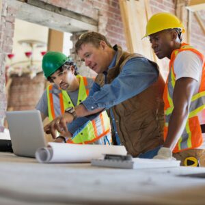 developer talks to construction crews 