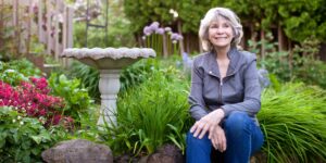 lady sits in garden