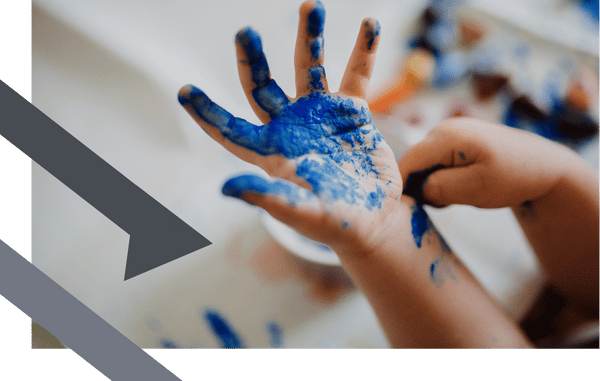 kids hand with blue paint