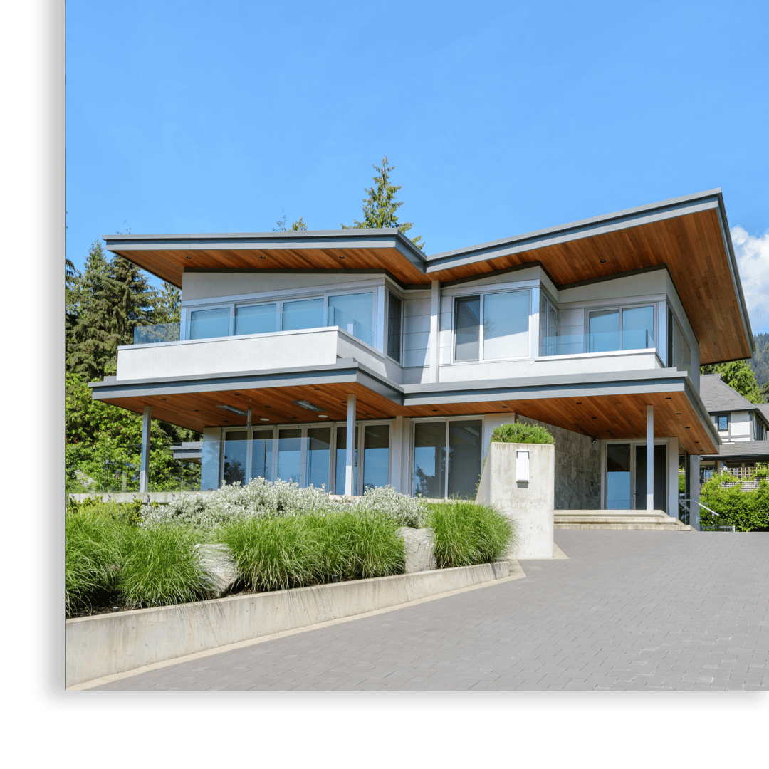 high end house with upper deck and roof overhang