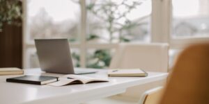 notebook and laptop on table