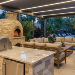 Upscale outdoor summer kitchen and lounge area with modern stone finishes and high-end appliances